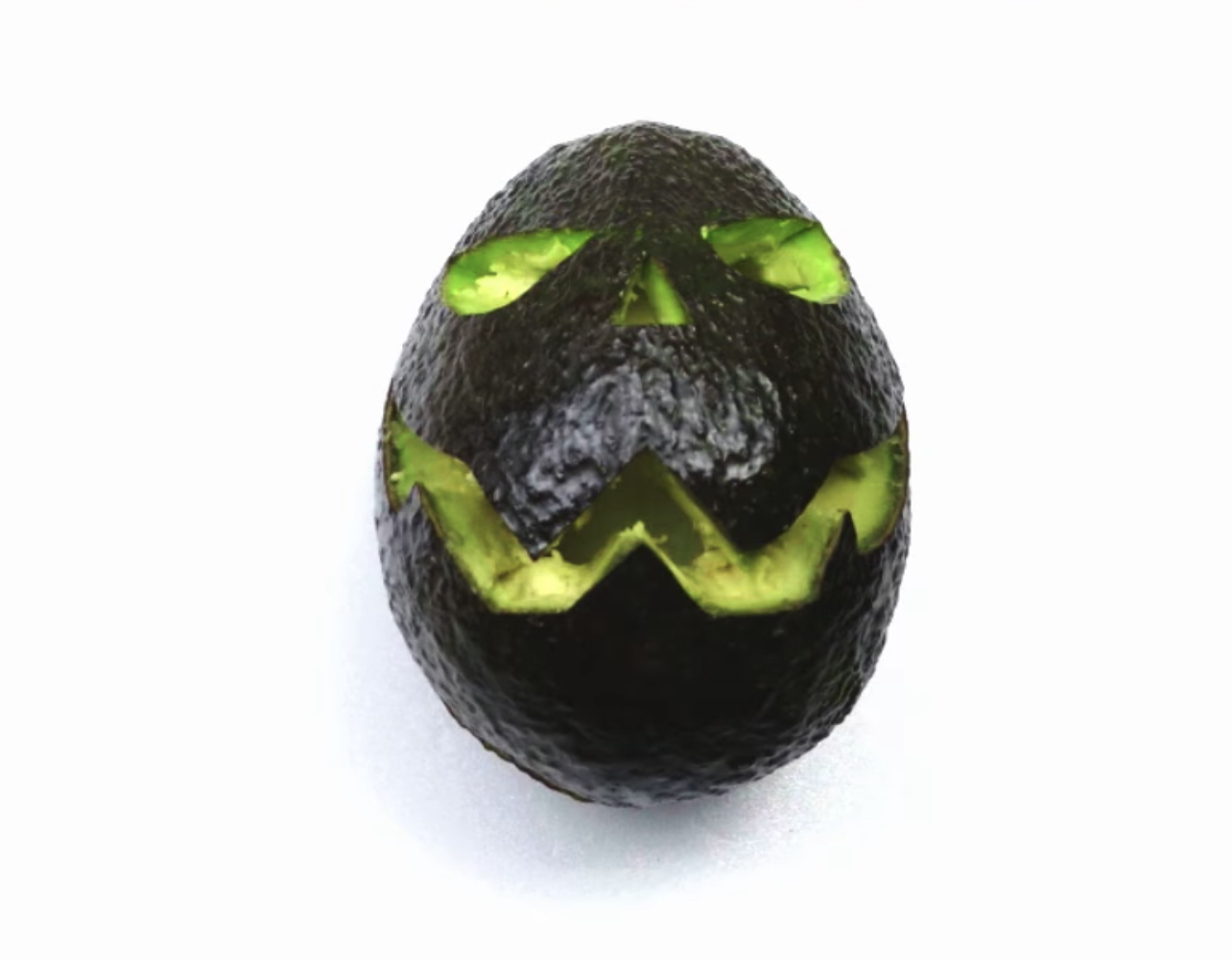 Forget Pumpkins: Here's How To Turn An Avocado Into A Jack-O'-Lantern